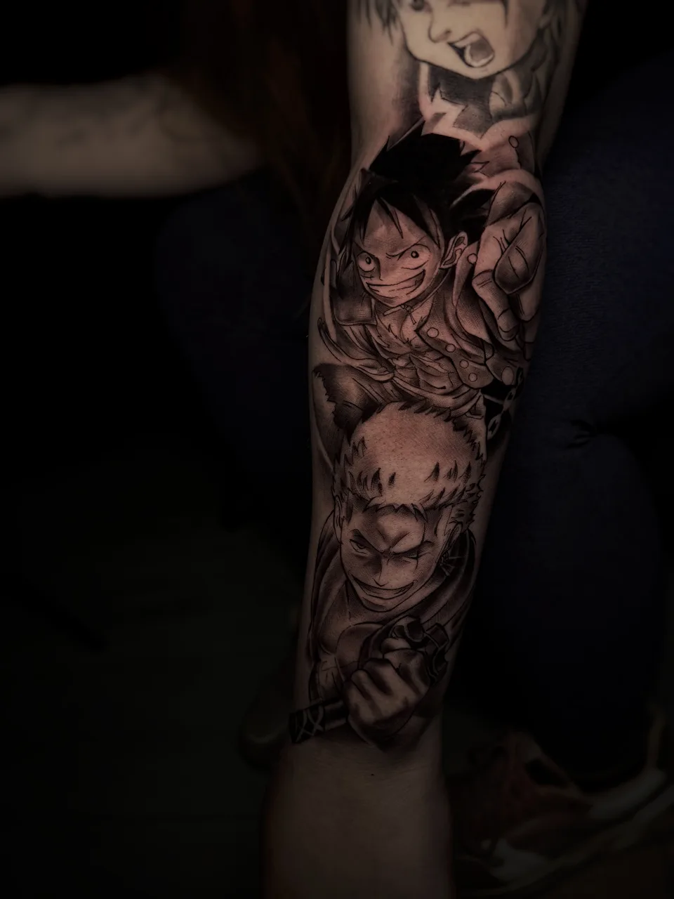 Luffy und Zoro Anime Tattoo am Unterarm
